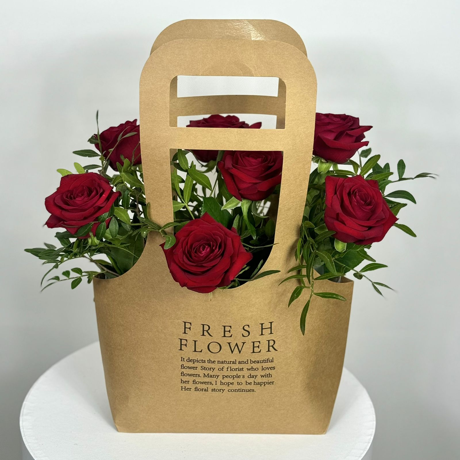 Bouquet 7 красных роз в сумочке 